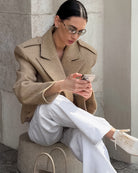 Beige Langry fashion trench coat with oversized lapels and button closure
