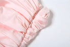 Pink ruffled fabric with delicate gathers in a fashionable backless Bud dress for women