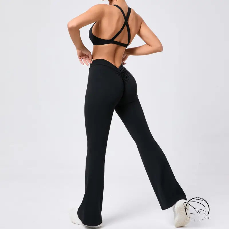 Peach tight brushed yoga clothes with high-waist black flared pants and mesh panels