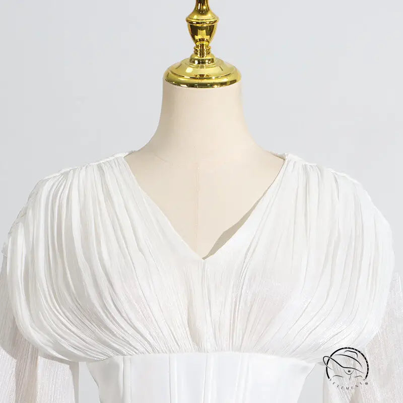 White langry fashion blouse with puff sleeves and v-neck design