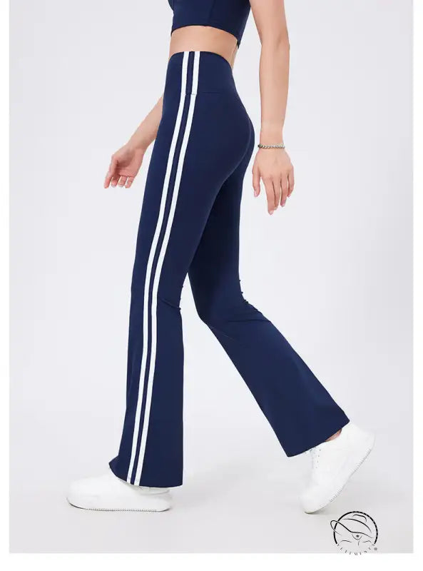Navy blue high waist yoga pants with white stripes and peach hip raise