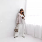 Woman in light-colored Collared Woolen Brushed Zipper Coat, showcasing elegant fashion style