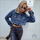 Woman in matching denim short coat with leather pants