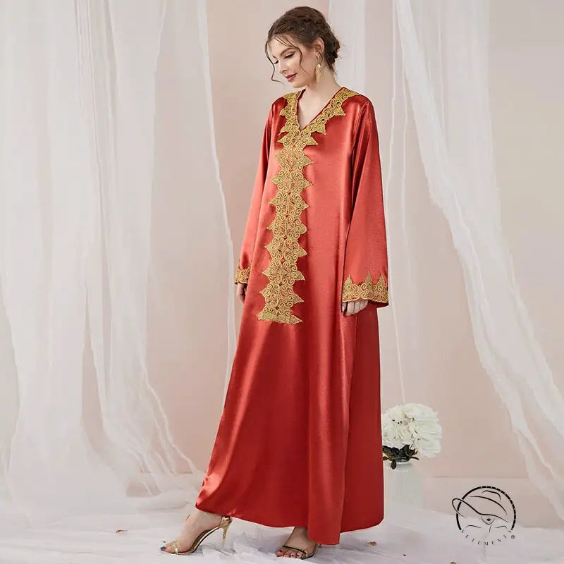 Elegant embroidered langry abaya in flowing red satin with gold details