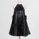 Black halter dress with floral embellishments, a stylish choice in ملابس fashion