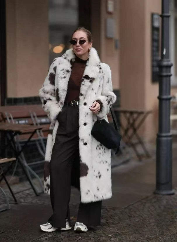 Cozy faux fur long coat in white black cow print with shearling collar