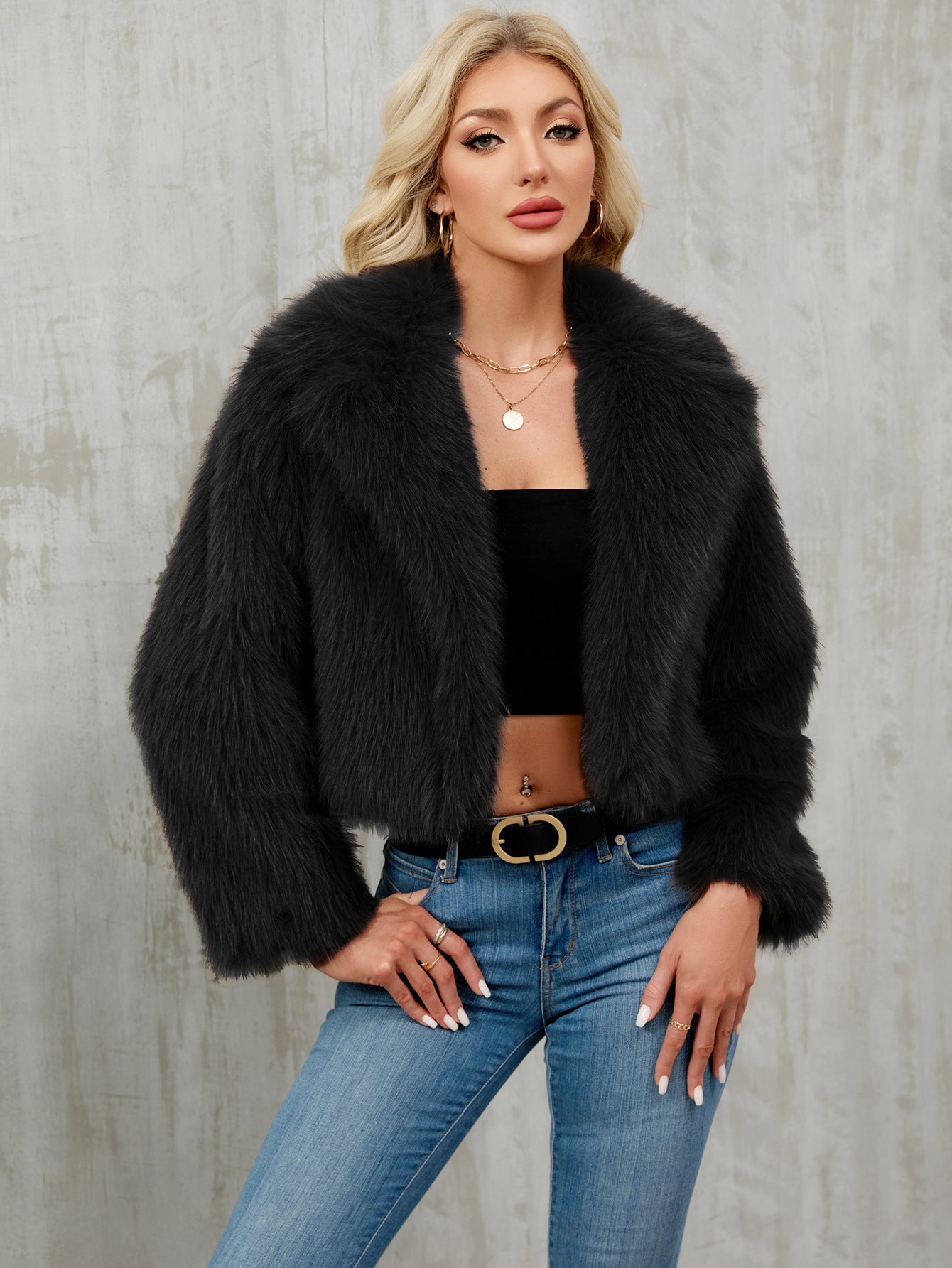 Black faux fur cropped jacket with plush voluminous collar and long sleeves