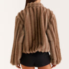 Loose warm furry jacket in brown faux fur with ribbed detailing and high collar