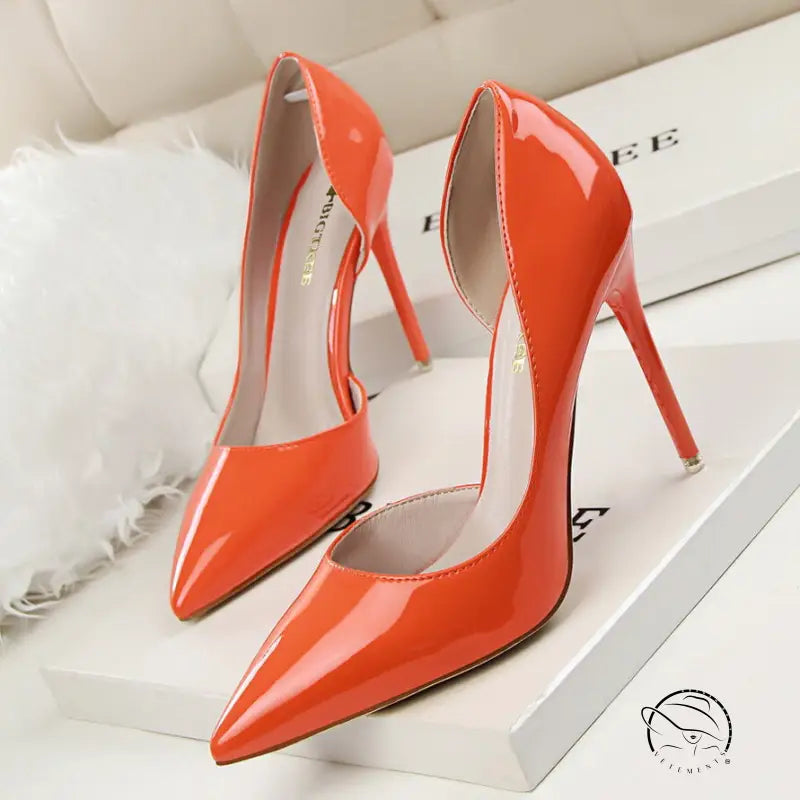 Glossy orange patent leather low cut high heels with pointed toes