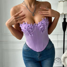 Low cut satin butterfly tube top in lavender with purple appliques and jeans