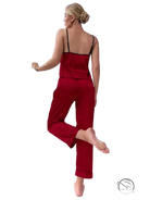 Red satin pajama set with black trim and black eye mask