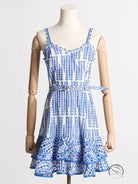 Blue and white summer machine embroidery sundress with spaghetti straps, ruffled hem, and waist slimming design