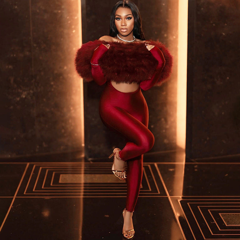 Red velvet off-shoulder long sleeve jumpsuit with fur accents and high slit