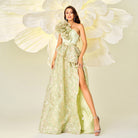 Elegant one-shoulder gown with floral embellishment and thigh-high slit for luxury fashion