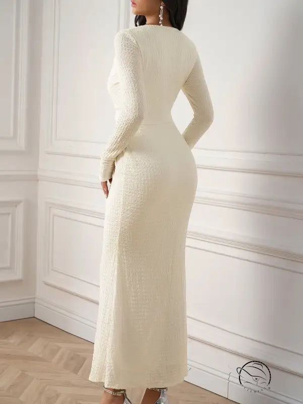 Beautiful knitted long-sleeved cream-colored dress