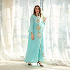 Light blue embroidered floral loose dress by Langry Fashion with gold accents, buttons, and high heels