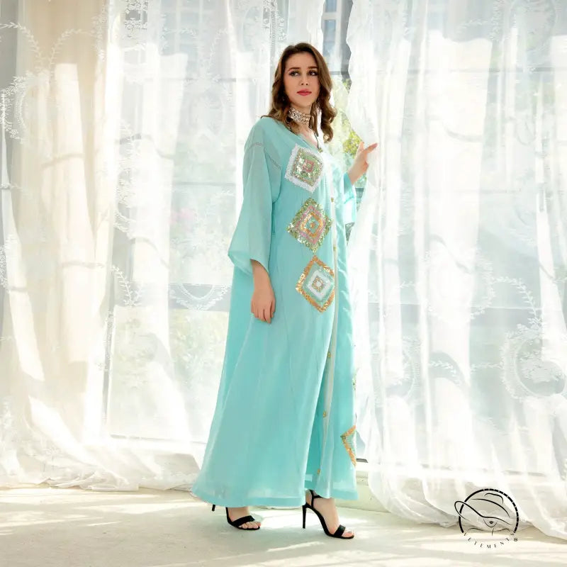 Light blue embroidered abaya with gold accents, langry fashion dress