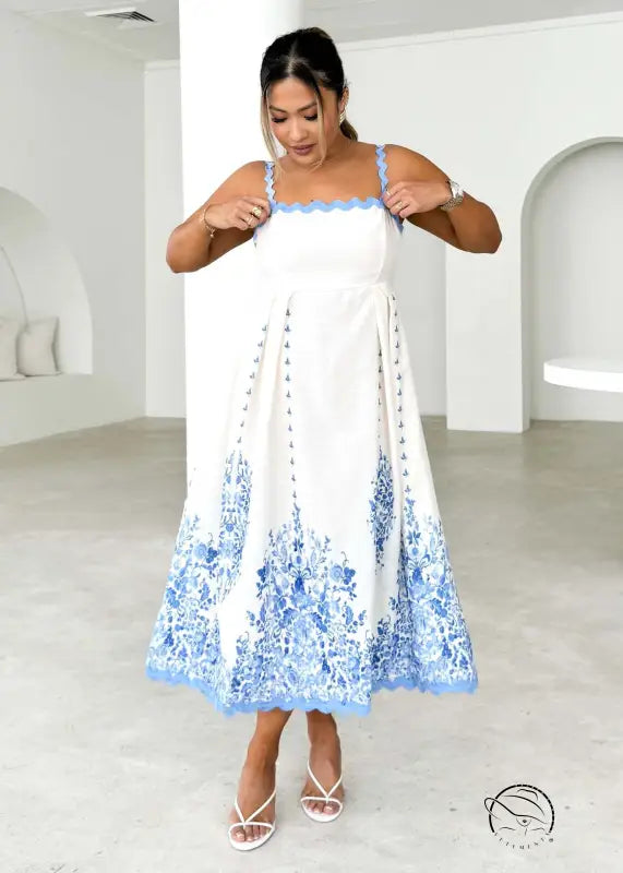 Attractive backless dress with white sundress and blue floral hem embroidery