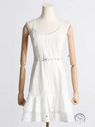 White eyelet lace summer machine embroidery sundress with ruffled hem and waist slimming design on mannequin