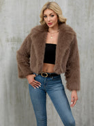 Plush faux fur cropped jacket with fluffy texture and long sleeves