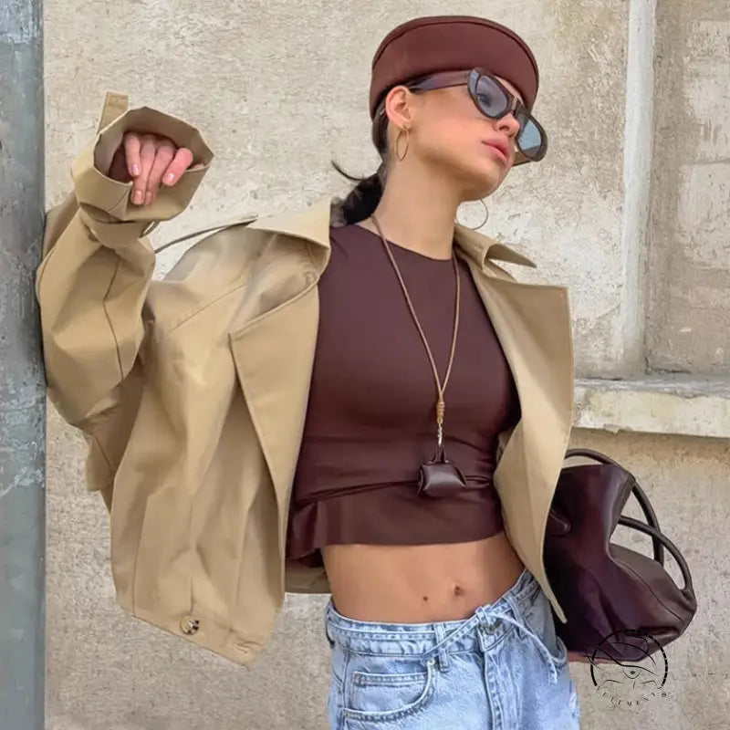Autumn khaki double breasted langry trench coat with brown leather crop top and gold chain