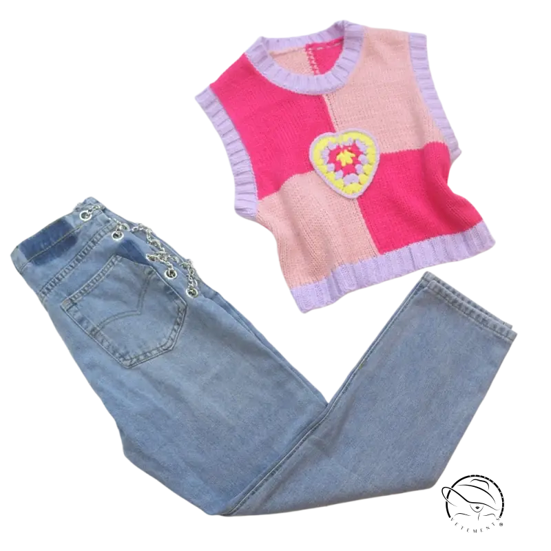 Pink knit vest with crocheted heart on chain straight jeans