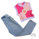 Pink knit vest with crocheted heart on chain straight jeans
