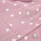 Pink crinkled cotton pajamas set with white hearts and buttons