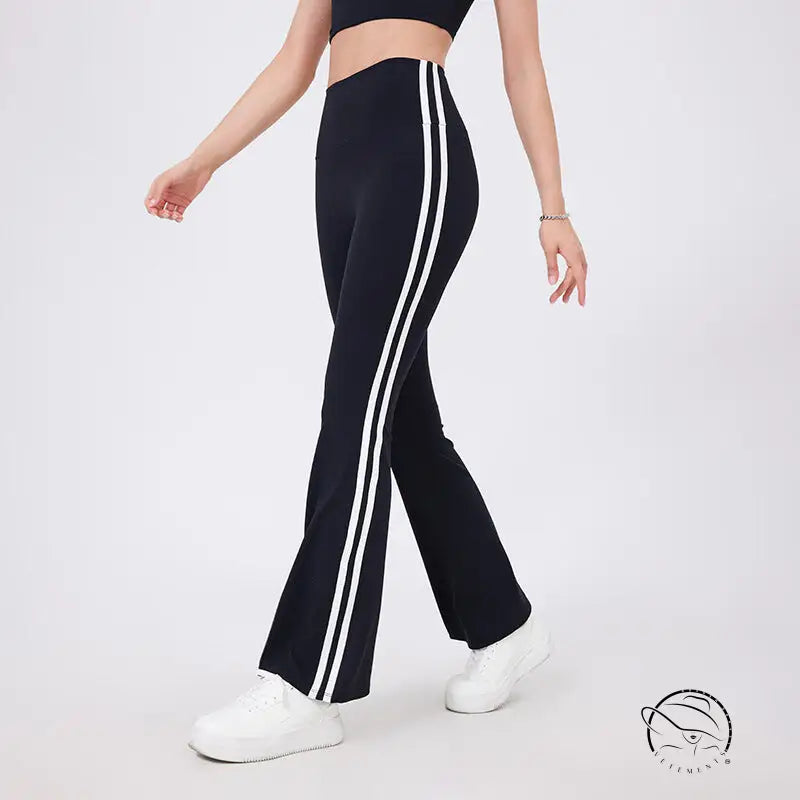 Black high waist yoga pants with white stripes and peach hip raise