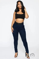 Woman in black crop top and casual skinny stretch belt sports pants