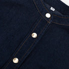 Dark blue denim shirt with band collar and gold snaps for fashionable dress