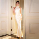 Elegant halter-neck gown in a luxurious French evening dress highlighting modern fashion