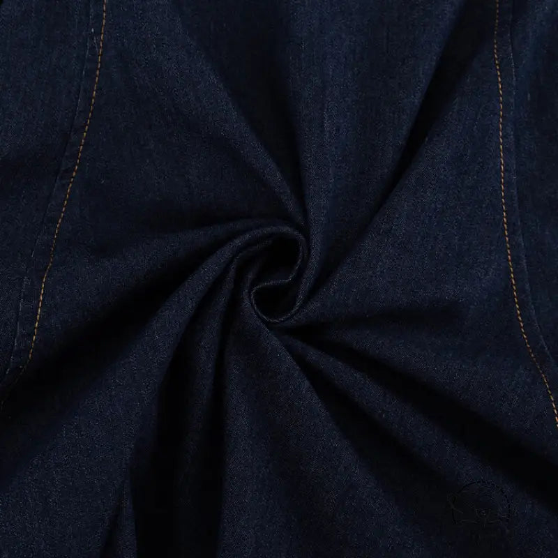Dark blue denim shirt with yellow stitching and central swirl