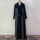 Black langry fashion abaya with velvet collar and paneling on mannequin