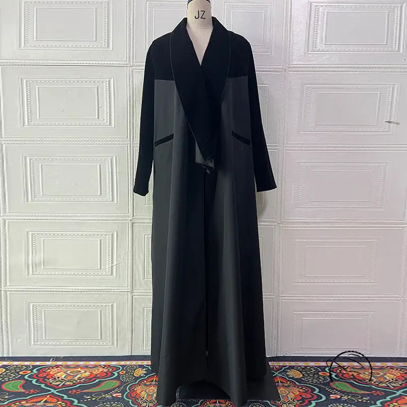 Black langry abaya with velvet collar and paneling on mannequin