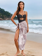 Black swimsuit with pink leaf-patterned sarong, ideal for Langry fashion ملابس