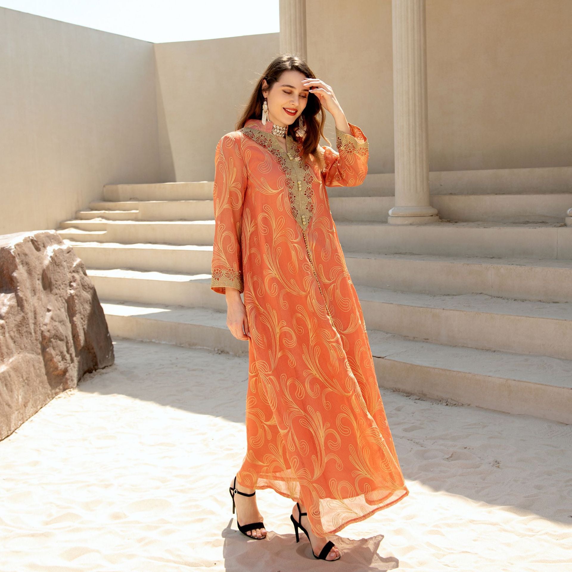 Enchanting Middle East langry fashion dress with orange embroidery, bell sleeves, high neckline, and swing style