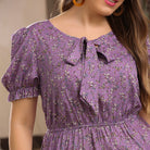 Purple floral dress with puff sleeves and bow neckline for fashionable summer outfits