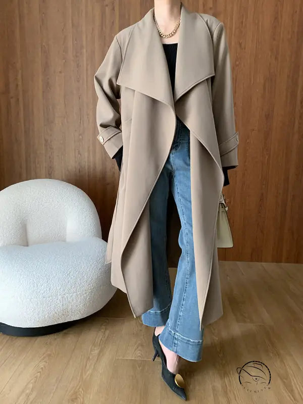 Tan trench coat with wide lapels in cozy langry fashion ملابس