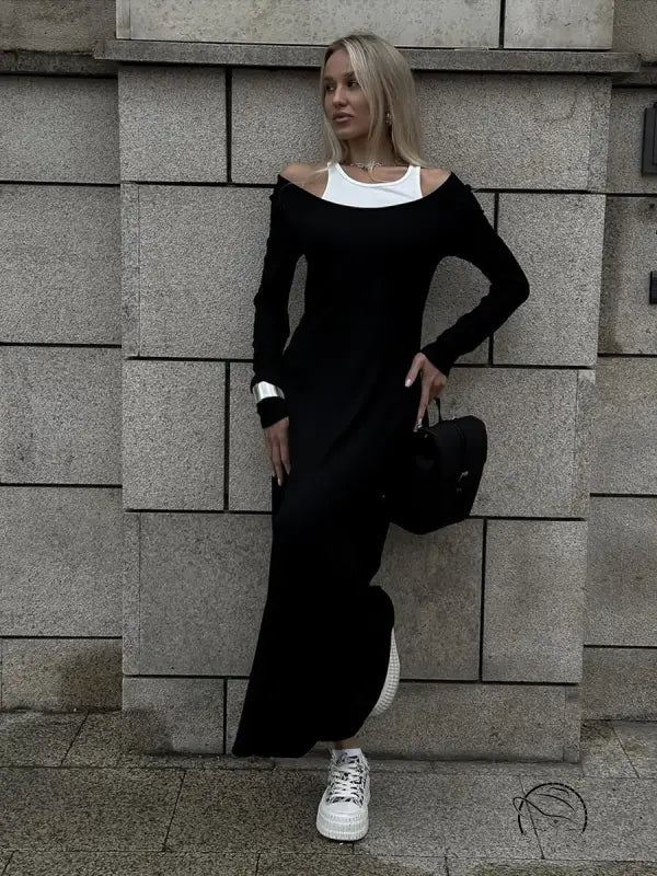 Attractive langry fashion two-piece vest dress in long black with white trim and sneakers