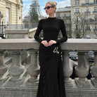 Elegant black langry fashion sheath dress with gold belt buckle