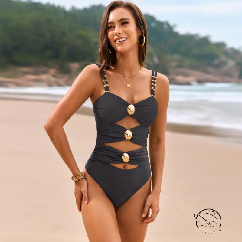 Black langry one-piece swimsuit with gold accents in comfy fashion ملابس