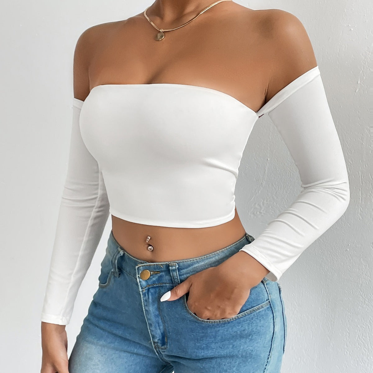 White off-the-shoulder long-sleeve crop top showcasing stylish langry fashion and ملابس trends