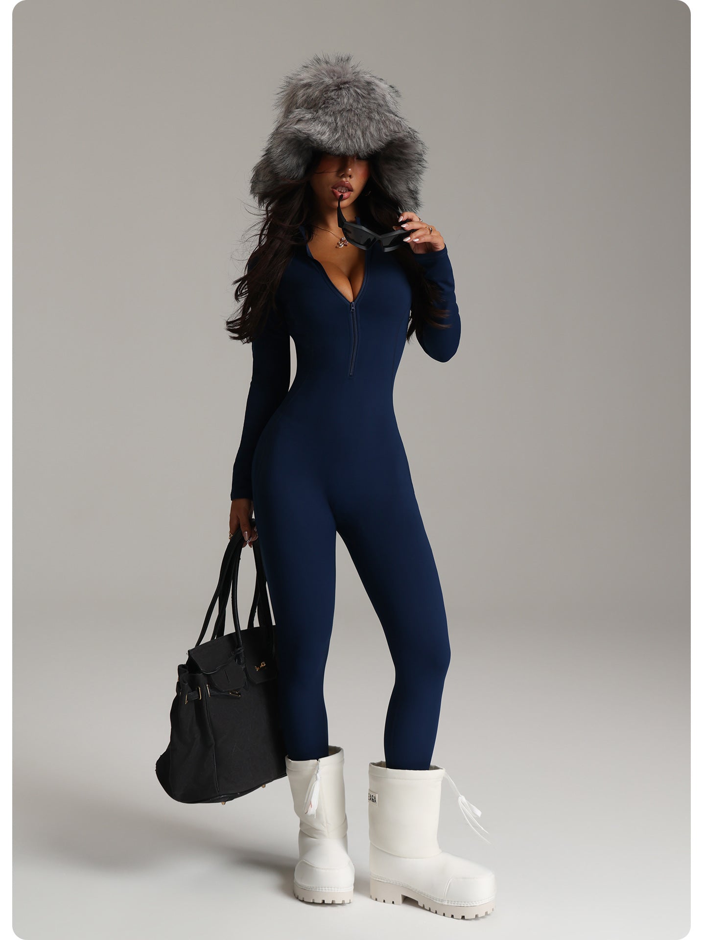 Navy blue langry fashion jumpsuit with fur hood and white boots