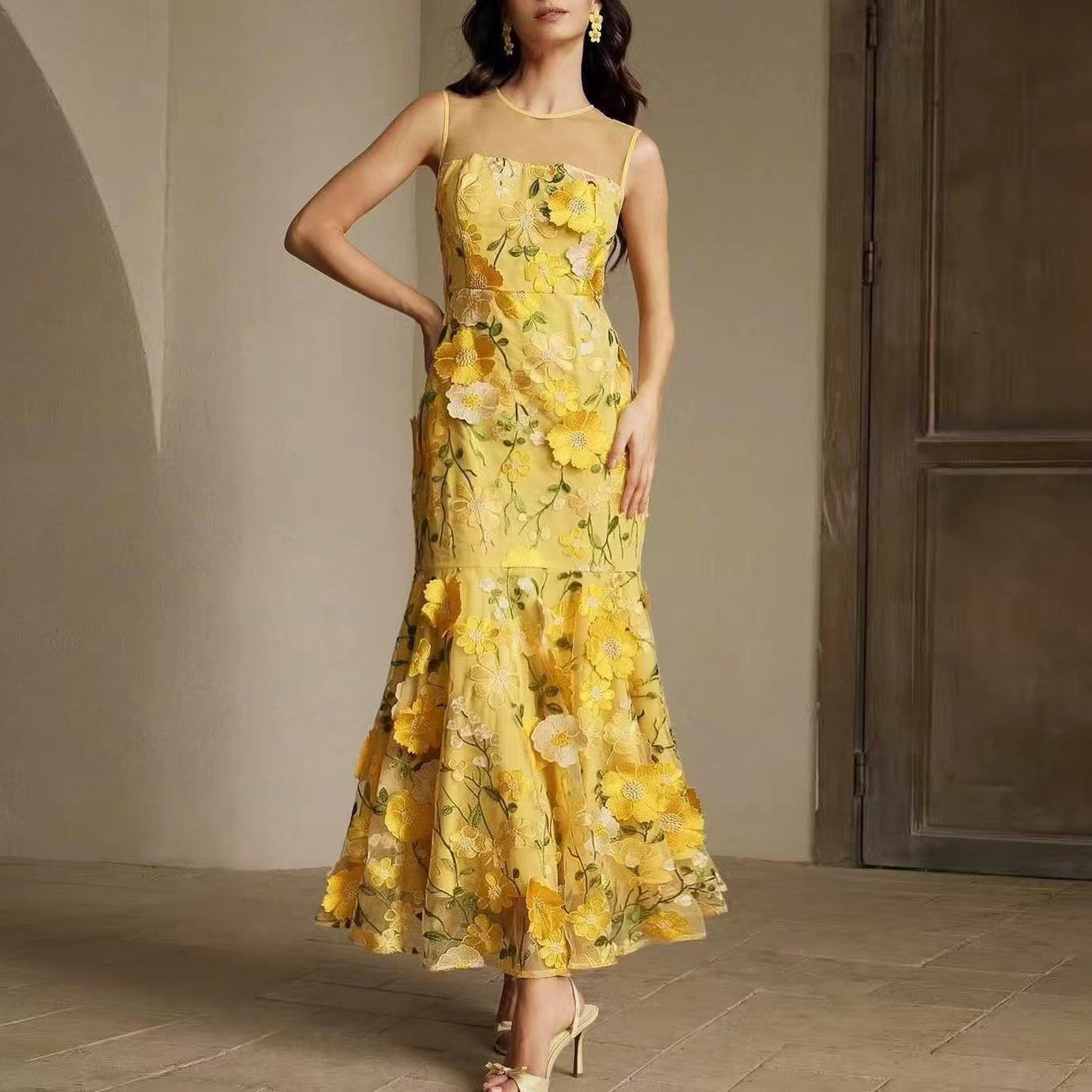 Vibrant yellow Langry fashion floral maxi dress with embroidered blossoms and sheer mesh fishtail bodice