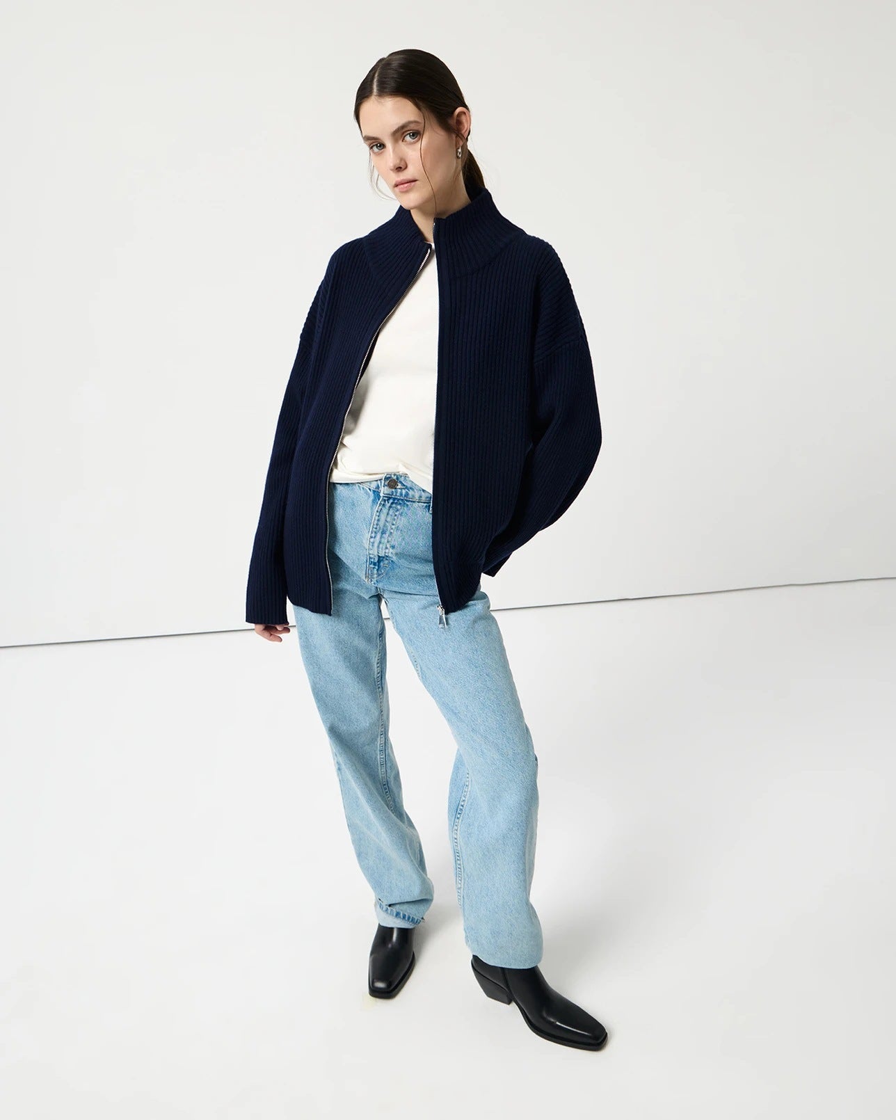 Navy blue langry cozy wool zip-up cardigan with regular sleeve, light wash jeans, black boots