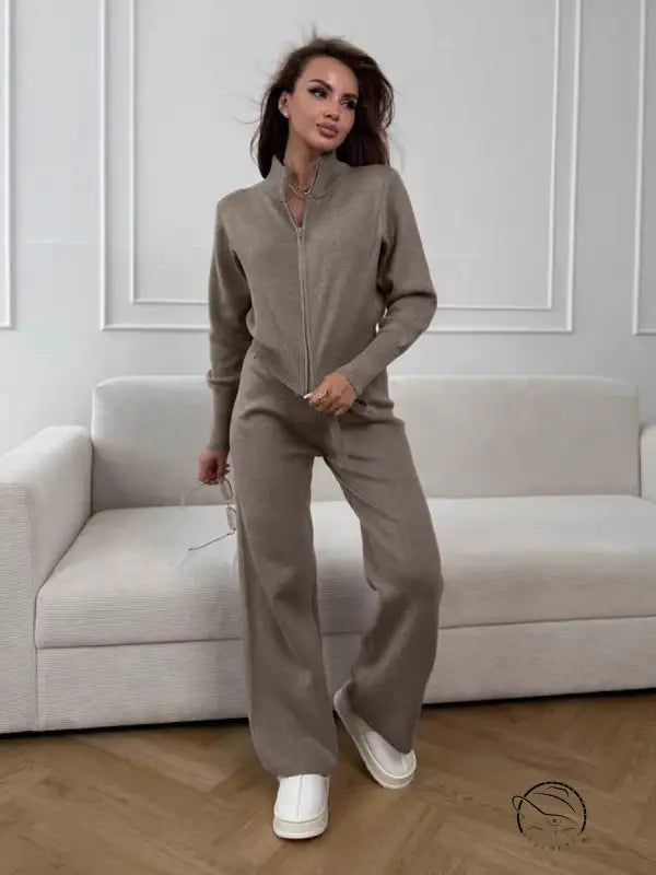 Langry fashion beige zip-up jumpsuit with white sneakers and minimalist ملابس design