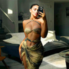 Woman in a floral mesh split dress showcasing summer fashion trends