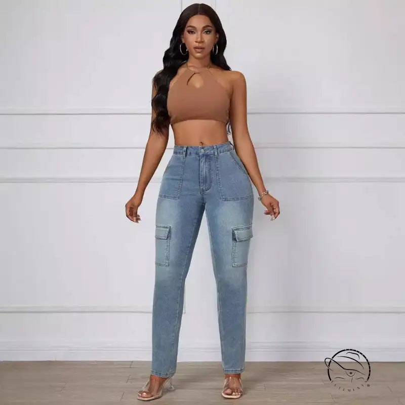 Straight skinny jeans in light wash blue with brown one-shoulder crop top