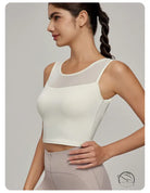 Woman in cream athletic crop top with mesh yoke, Beauty Back Mesh Workout Top
